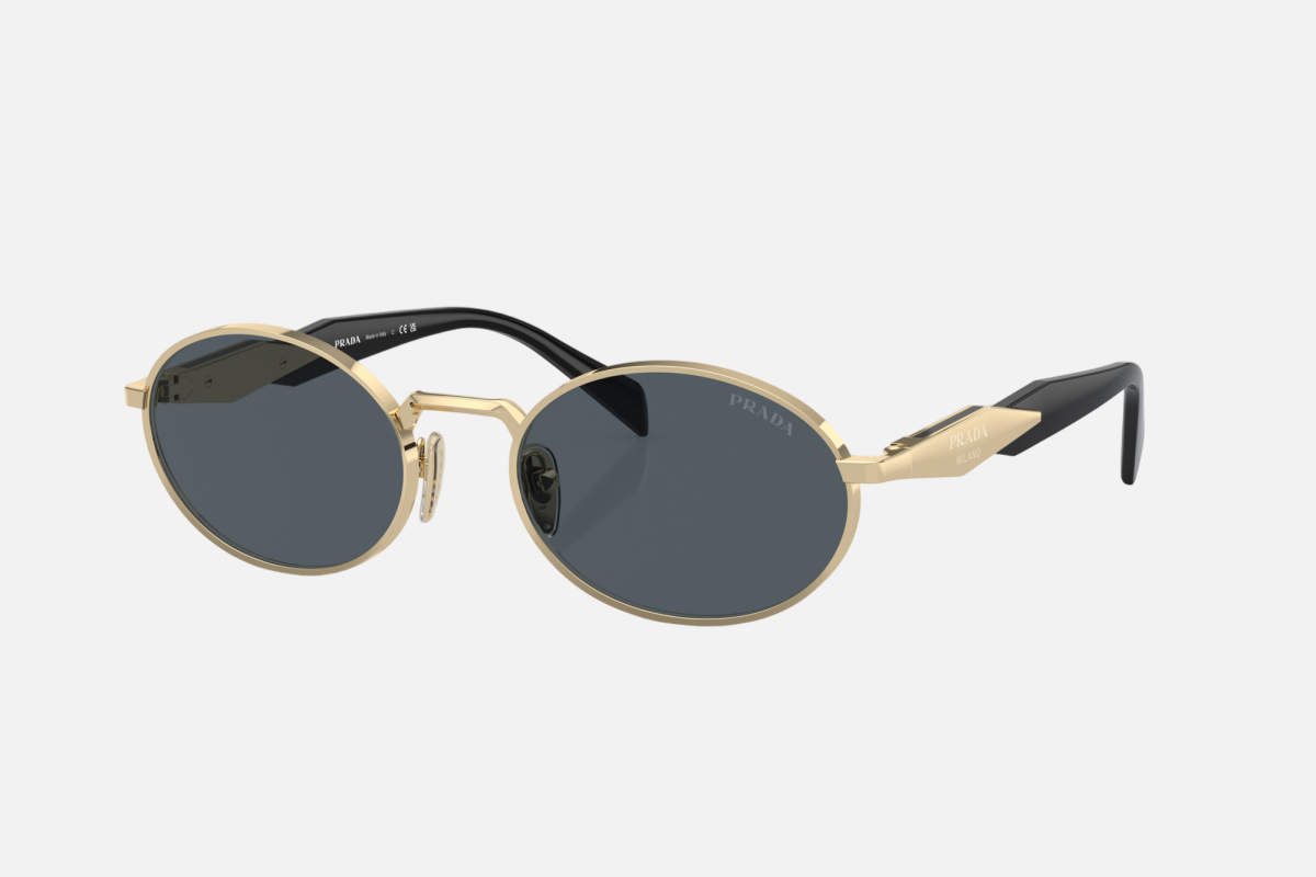 Prada PR 65ZS ZVN09T oval sunglasses for women in full rim metal, with pale gold frame, and dark grey lenses. 55mm in lens size, 20mm in bridge size, and 140mm in temple length.