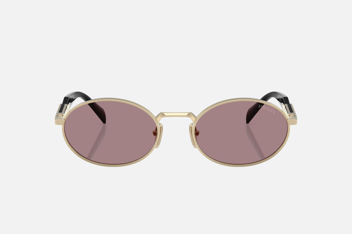 Prada PR 65ZS ZVN20I oval sunglasses for women in full rim metal, with pale gold frame, and light purple lenses. 55mm in lens size, 20mm in bridge size, and 140mm in temple length.