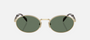Prada PR 65ZS ZVN70L oval sunglasses for women in full rim metal, with pale gold frame, and dark green lenses. 55mm in lens size, 20mm in bridge size, and 140mm in temple length.