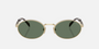 Prada PR 65ZS ZVN70L oval sunglasses for women in full rim metal, with pale gold frame, and dark green lenses. 55mm in lens size, 20mm in bridge size, and 140mm in temple length.
