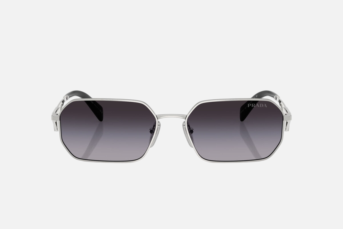 Prada PR A51S 1BC90A irregular sunglasses for women in full rim metal, with silver frame, and grey gradient lenses. 58mm in lens size, 17mm in bridge size, and 140mm in temple length.
