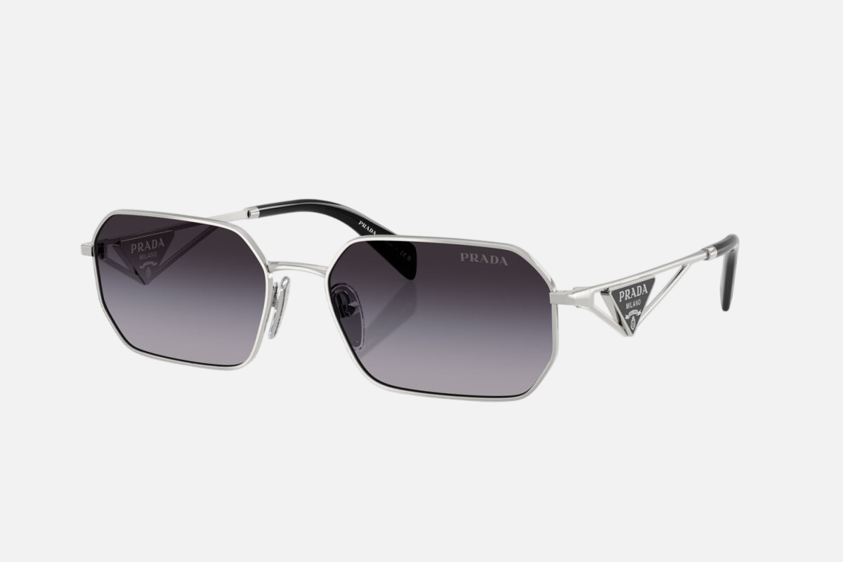 Prada PR A51S 1BC90A irregular sunglasses for women in full rim metal, with silver frame, and grey gradient lenses. 58mm in lens size, 17mm in bridge size, and 140mm in temple length.