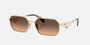 Prada PR A51S ZVN50C irregular sunglasses for women in full rim metal, with pale gold frame, and brown with grey gradient lenses. 58mm in lens size, 17mm in bridge size, and 140mm in temple length.