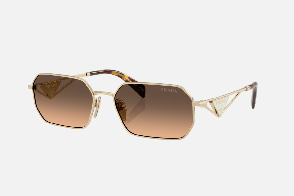 Prada PR A51S ZVN50C irregular sunglasses for women in full rim metal, with pale gold frame, and brown with grey gradient lenses. 58mm in lens size, 17mm in bridge size, and 140mm in temple length.