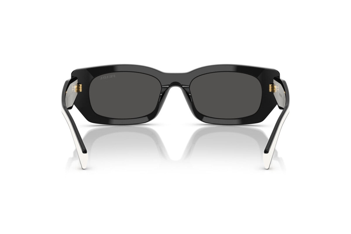 Prada PR B05S 09Q08Z pillow sunglasses for women in full rim acetate, with black frame, and dark grey lenses. 53mm in lens size, 19mm in bridge size, and 140mm in temple length.