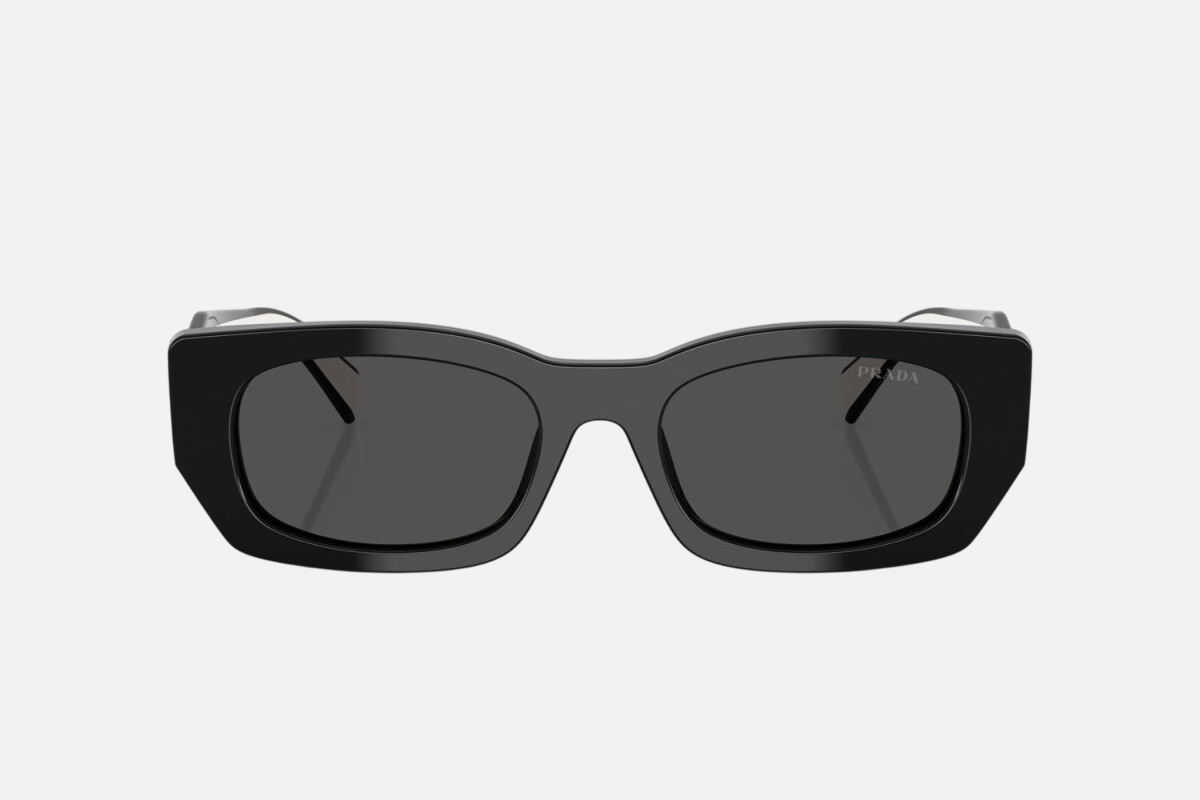 Prada PR B05S 09Q08Z pillow sunglasses for women in full rim acetate, with black frame, and dark grey lenses. 53mm in lens size, 19mm in bridge size, and 140mm in temple length.