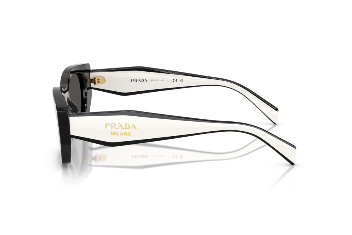 Prada PR B05S 09Q08Z pillow sunglasses for women in full rim acetate, with black frame, and dark grey lenses. 53mm in lens size, 19mm in bridge size, and 140mm in temple length.