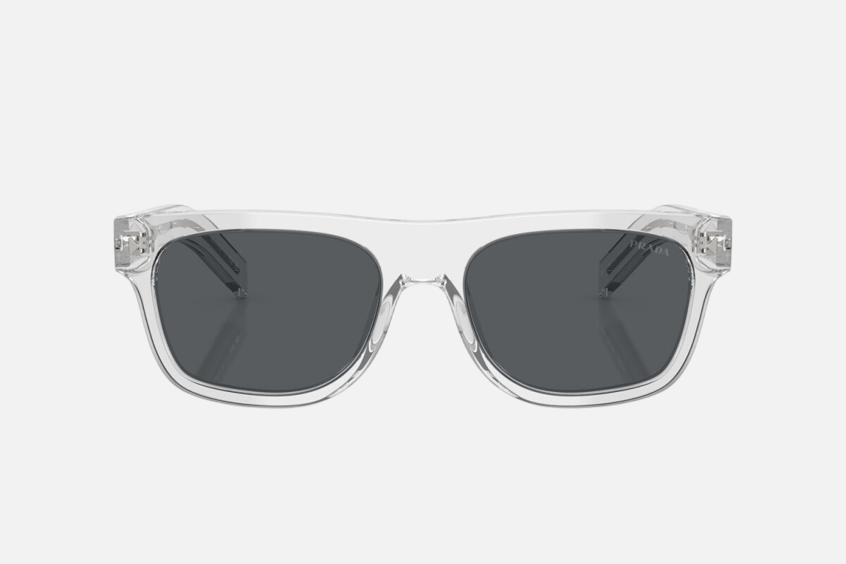 Prada PR B12S 12R07T square sunglasses for men in full rim acetate, with transparent grey frame, and dark blue lenses. 55mm in lens size, 19mm in bridge size, and 145mm in temple length.