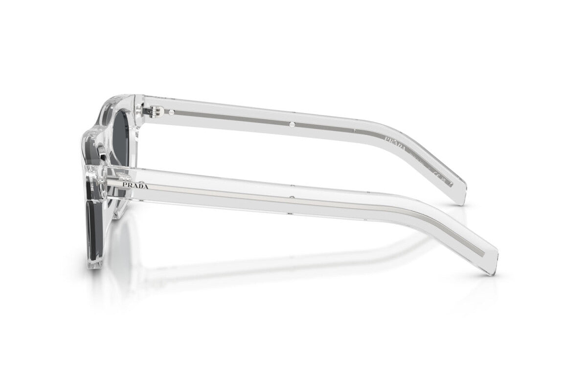 Prada PR B12S 12R07T square sunglasses for men in full rim acetate, with transparent grey frame, and dark blue lenses. 55mm in lens size, 19mm in bridge size, and 145mm in temple length.