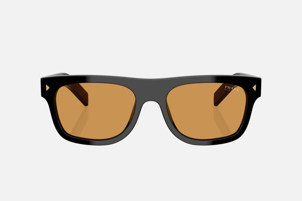 Prada PR B12S 16K60F square sunglasses for men in full rim acetate, with black frame, and photochromic brown lenses. 55mm in lens size, 19mm in bridge size, and 145mm in temple length.