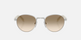 Prada PR B52S 1BC80K round sunglasses for women in full rim steel, with silver frame, and light yellow with brown lenses. 49mm in lens size, 21mm in bridge size, and 145mm in temple length.