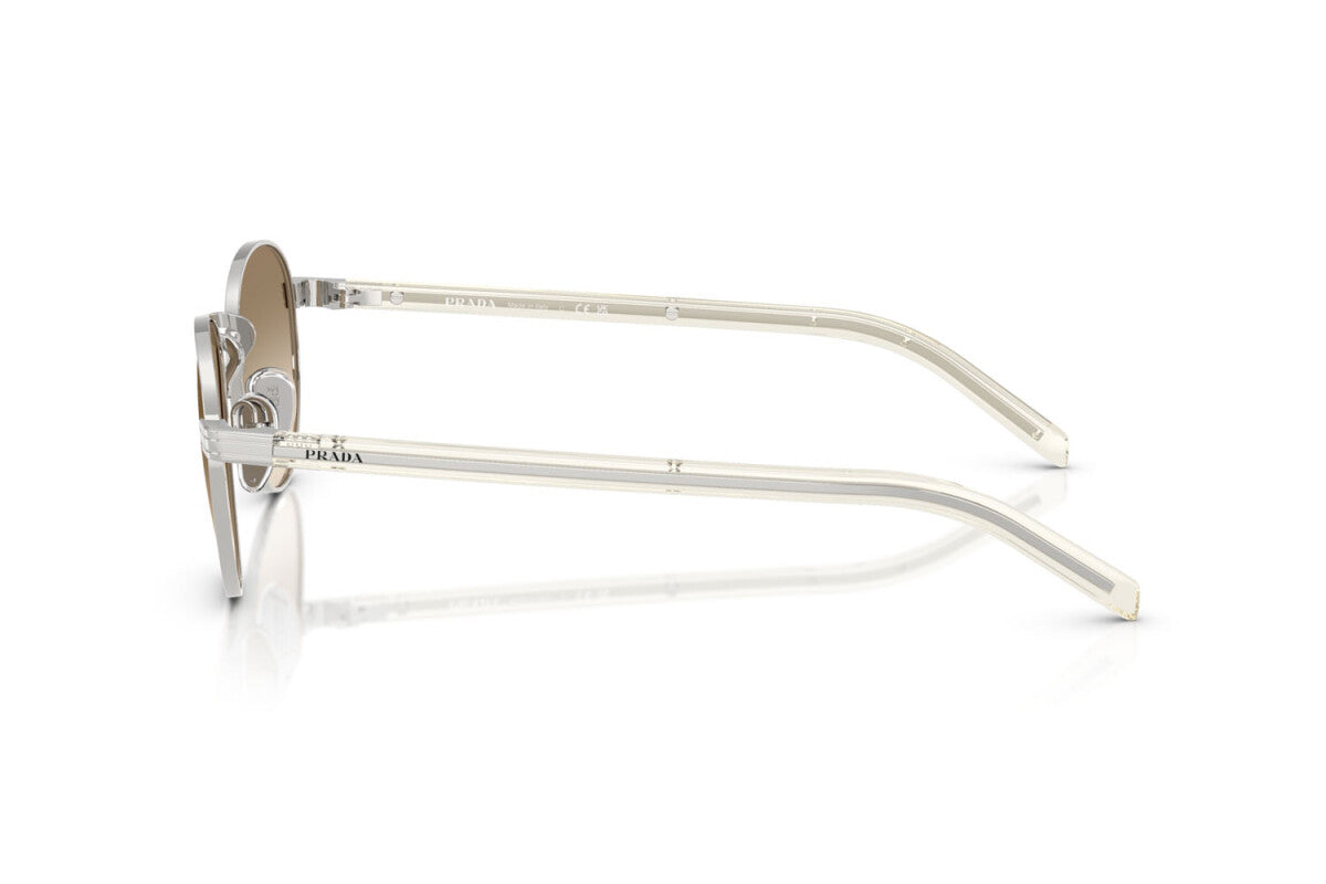 Prada PR B52S 1BC80K round sunglasses for women in full rim steel, with silver frame, and light yellow with brown lenses. 49mm in lens size, 21mm in bridge size, and 145mm in temple length.