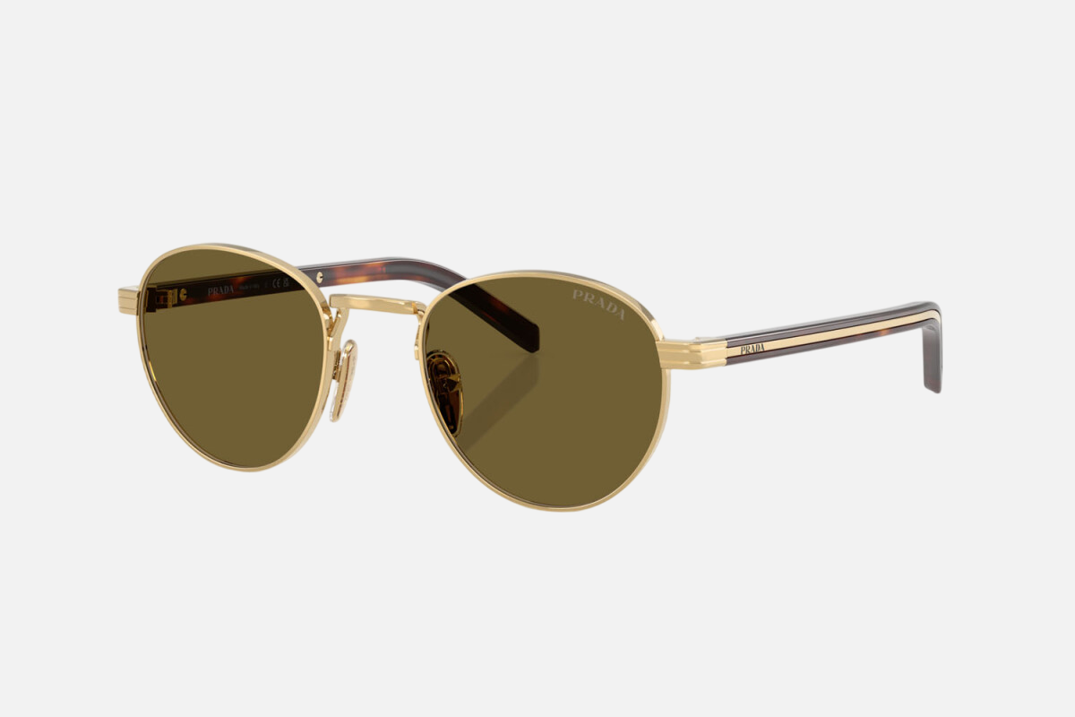 Prada PR B52S 5AK09Z round sunglasses for women in full rim steel, with gold frame, and dark brown lenses.