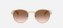 Prada PR B52S ZVN0A6 round sunglasses for women in full rim steel, with pale gold frame, and brown gradient lenses. 49mm in lens size, 21mm in bridge size, and 145mm in temple length.