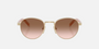 Prada PR B52S ZVN0A6 round sunglasses for women in full rim steel, with pale gold frame, and brown gradient lenses. 49mm in lens size, 21mm in bridge size, and 145mm in temple length.
