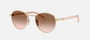 Prada PR B52S ZVN0A6 round sunglasses for women in full rim steel, with pale gold frame, and brown gradient lenses. 49mm in lens size, 21mm in bridge size, and 145mm in temple length.