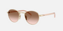 Prada PR B52S ZVN0A6 round sunglasses for women in full rim steel, with pale gold frame, and brown gradient lenses. 49mm in lens size, 21mm in bridge size, and 145mm in temple length.