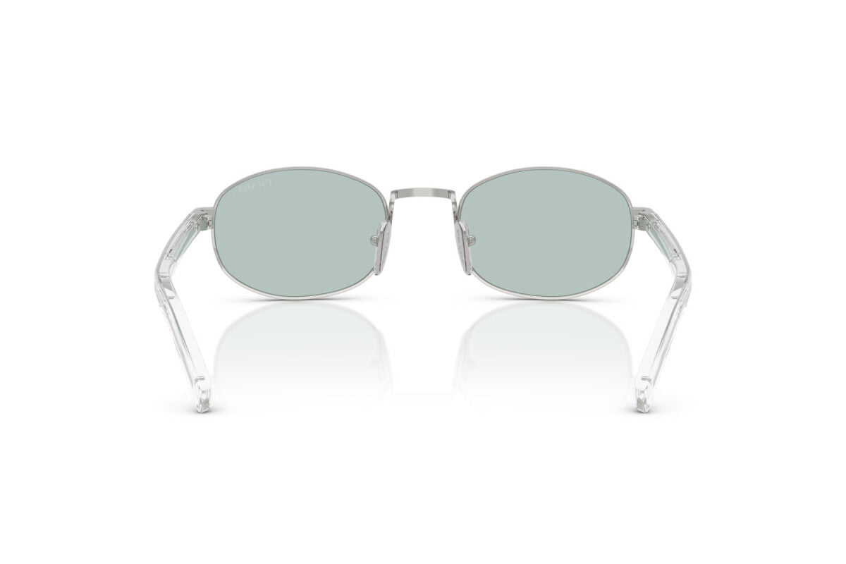 Prada PR B53S 1BC40N oval sunglasses for women in full rim steel, with silver frame, and sky blue lenses. 49mm in lens size, 21mm in bridge size, and 145mm in temple length.