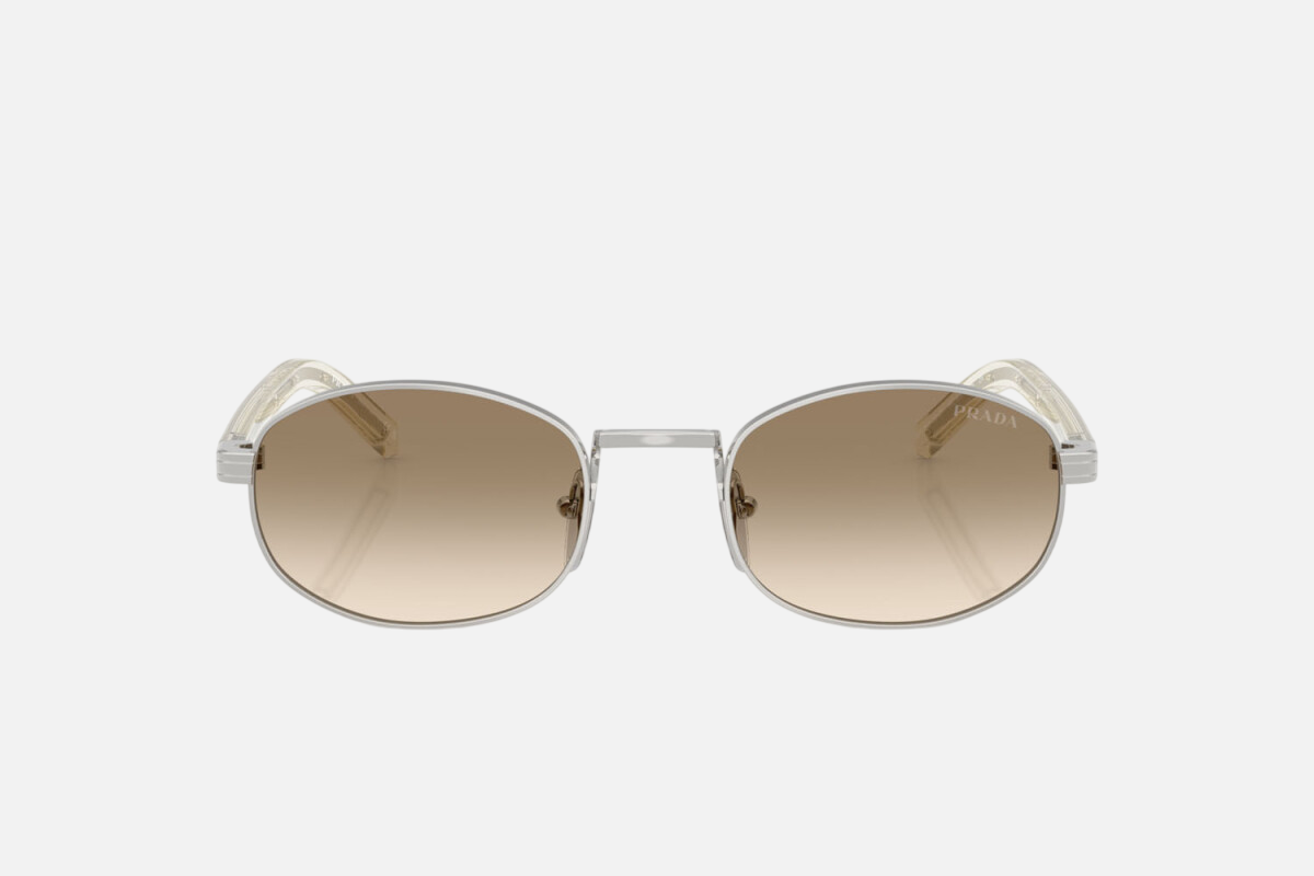 Prada PR B53S 1BC80K oval sunglasses for women in full rim steel, with silver frame, and light yellow with brown lenses. 52mm in lens size, 21mm in bridge size, and 145mm in temple length.
