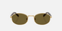 Prada PR B53S 5AK09Z oval sunglasses for women in full rim steel, with gold frame, and dark brown lenses.