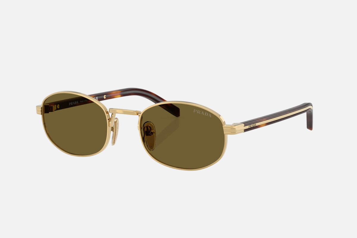 Prada PR B53S 5AK09Z oval sunglasses for women in full rim steel, with gold frame, and dark brown lenses.