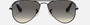 Ray-Ban Junior Aviator Kids RJ9506S 220/11 pilot sunglasses for kids in full rim metal, with polished black frame, and grey gradient lenses. 52mm in lens size, 14mm in bridge size, and 125mm in temple length.
