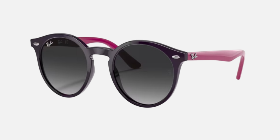Ray-Ban Junior RJ9064S 70218G phantos sunglasses for kids in full rim injected, with polished violet frame, and light grey gradient dark grey
  lenses. 44mm in lens size, 19mm in bridge size, and 130mm in temple length.