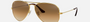 Ray-Ban Aviator Gradient RB3025 001/51 aviator sunglasses for unisex in full rim metal, with gold frame, and light brown lenses. 58mm in lens size, 14mm in bridge size, and 135mm in temple length.