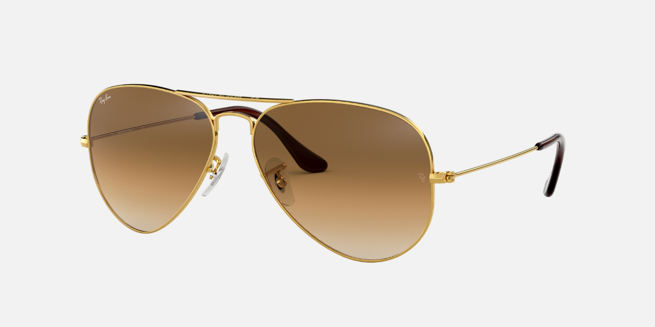 Ray-Ban RB3025 001/51 unisex's full rim aviator sunglasses in a gold metal frame with light brown lenses. Features a 62 mm lens size, 14 mm bridge size, and 135 mm temple length. Available in Dubai, UAE.