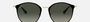 Ray-Ban RB3546 187/71 round sunglasses for women in full rim metal, with black on gold frame, and grey gradient lenses. 52mm in lens size, 20mm in bridge size, and 145mm in temple length.