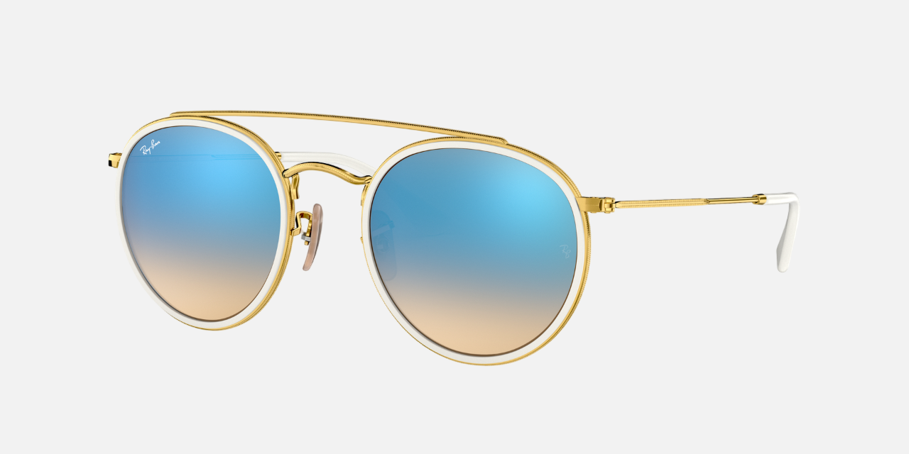 Ray-Ban Round Double Bridge RB3647N 001/4O unisex's full rim round sunglasses in a polished arista gold metal frame with blue flash lenses. Features a 51 mm lens size, 22 mm bridge size, and 145 mm temple length. Available in Dubai, UAE.