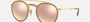 Ray-Ban Round Double Bridge RB3647N 001/7O round double bridge sunglasses for unisex in full rim metal, with gold frame, and brown mirror lenses. 51mm in lens size, 22mm in bridge size, and 145mm in temple length.