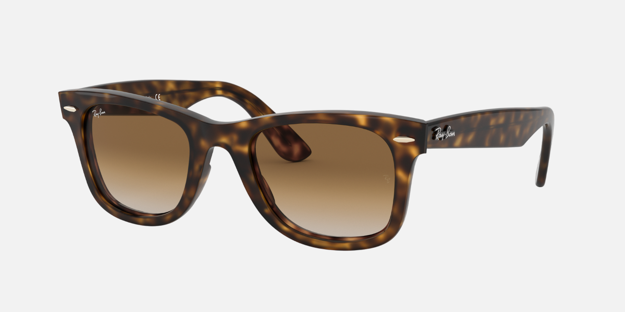 Ray-Ban Wayfarer Ease RB4340 710/51 unisex's full rim square sunglasses in a polished light havana injected frame with light brown gradient lenses. Features a 50 mm lens size, 22 mm bridge size, and 150 mm temple length. Available in Dubai, UAE.