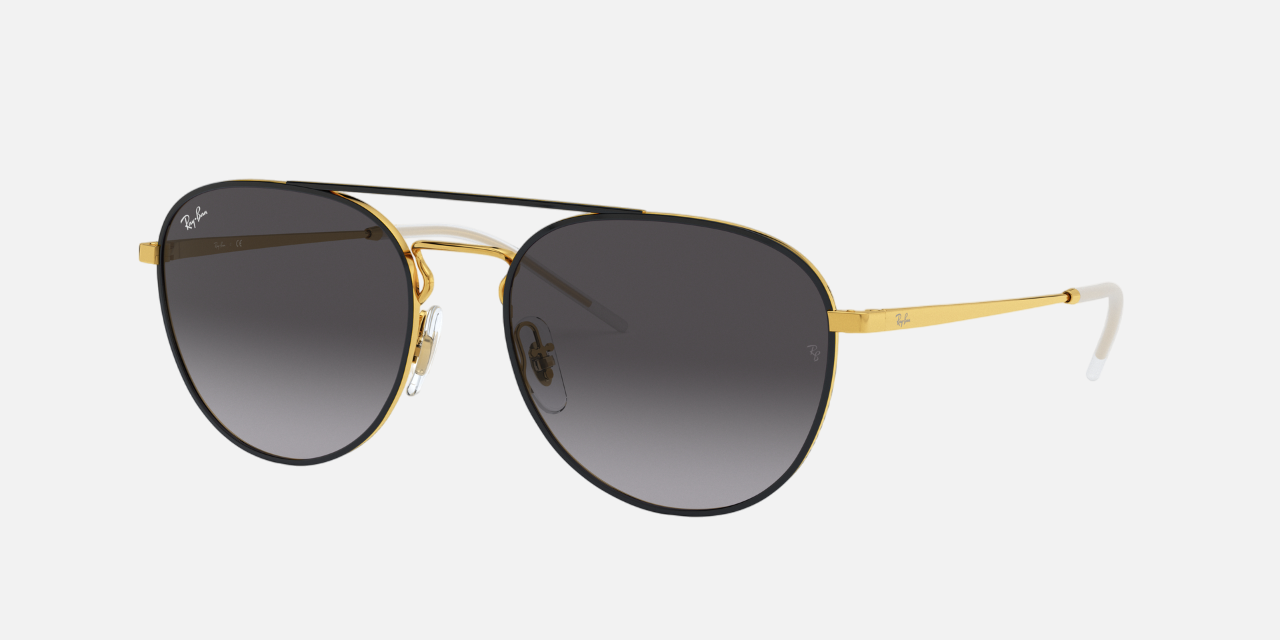 Ray-Ban RB3589 90548G unisex's full rim round sunglasses in a black on gold metal frame with grey lenses. Features a 55 mm lens size, 18 mm bridge size, and 145 mm temple length. Available in Dubai, UAE.
