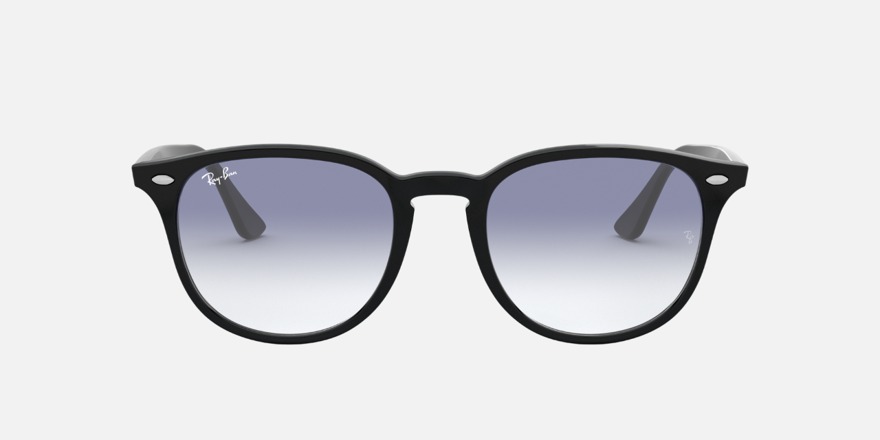 Ray-Ban RB4259 601/19 round sunglasses for unisex in full rim plastic, with black frame, and clear gradient light blue lenses. 51mm in lens size, 20mm in bridge size, and 145mm in temple length.