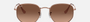 Ray-Ban Hexagonal Flat Lenses RB3548N 9069A5 hexagonal sunglasses for unisex in full rim metal, with copper frame, and brown gradient lenses. 54mm in lens size, 21mm in bridge size, and 145mm in temple length.