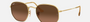 Ray-Ban Hexagonal Flat Lenses RB3548N 912443 hexagonal sunglasses for unisex in full rim metal, with gold frame, and brown lenses. 51mm in lens size, 21mm in bridge size, and 145mm in temple length.