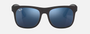 Ray-Ban Junior Justin Kids RJ9069S 702855 square sunglasses for kids in full rim injected, with matte rubber black frame, and blue mirror lenses. 48mm in lens size, 16mm in bridge size, and 130mm in temple length.