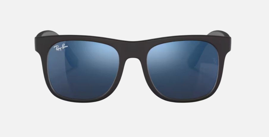 Ray-Ban Junior Justin Kids RJ9069S 702855 square sunglasses for kids in full rim injected, with matte rubber black frame, and blue mirror lenses. 48mm in lens size, 16mm in bridge size, and 130mm in temple length.
