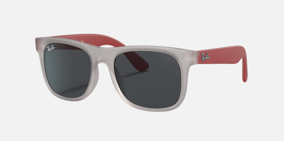Ray-Ban Junior Justin Kids RJ9069S 705987 square sunglasses for kids in full rim injected, with matte transparent grey frame, and dark grey lenses. 48mm in lens size, 16mm in bridge size, and 130mm in temple length.