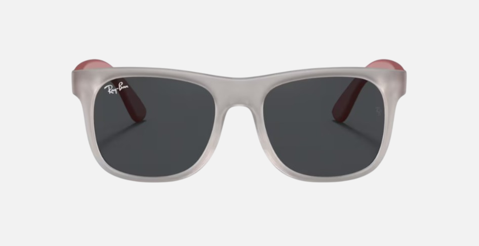 Ray-Ban Junior Justin Kids RJ9069S 705987 square sunglasses for kids in full rim injected, with matte transparent grey frame, and dark grey lenses. 48mm in lens size, 16mm in bridge size, and 130mm in temple length.