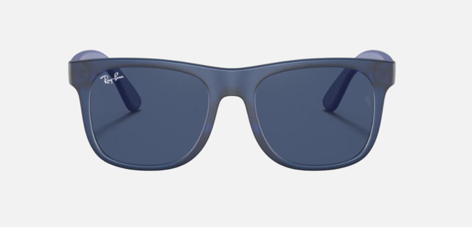 Ray-Ban Junior Justin Kids RJ9069S 706080 square sunglasses for kids in full rim injected, with matte transparent blue frame, and dark blue lenses. 48mm in lens size, 16mm in bridge size, and 130mm in temple length.
