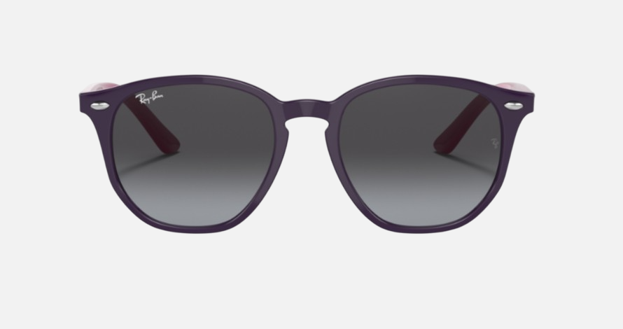 Ray-Ban Junior RJ9070S 70218G irregular sunglasses for kids in full rim injected, with polished violet frame, and grey gradient lenses. 46mm in lens size, 16mm in bridge size, and 130mm in temple length.