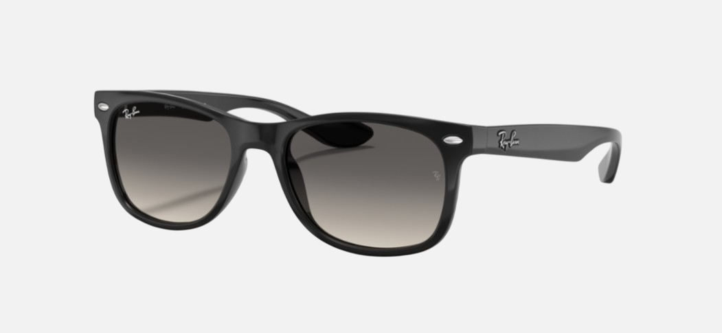 Ray-Ban Junior New Wayfarer Kids RJ9052S 100/11 square sunglasses for kids in full rim injected, with polished black frame, and light/dark grey lenses. 47mm in lens size, 15mm in bridge size, and 125mm in temple length.