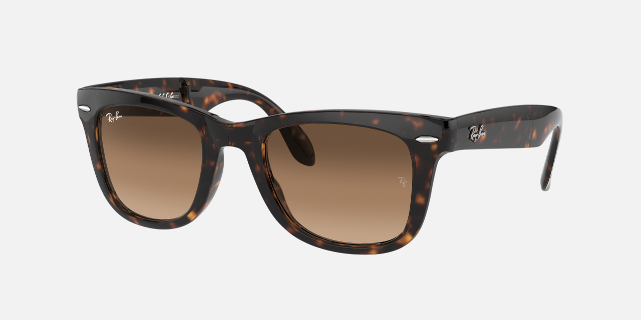 Ray-Ban Wayfarer Folding Classic RB4105 710/51 men's full rim square sunglasses in a light havana injected frame with light brown gradient lenses. Features a 50 mm lens size, 22 mm bridge size, and 140 mm temple length. Available in Dubai, UAE.