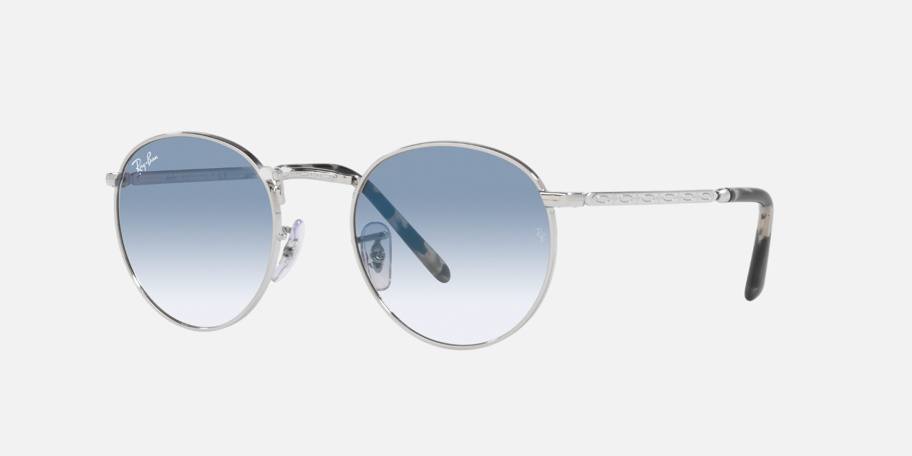 Ray-Ban New Round RB3637 003/3F unisex's full rim round sunglasses in a silver metal frame with clear gradient blue lenses. Features a 53 mm lens size, 21 mm bridge size, and 140 mm temple length. Available in Dubai, UAE.