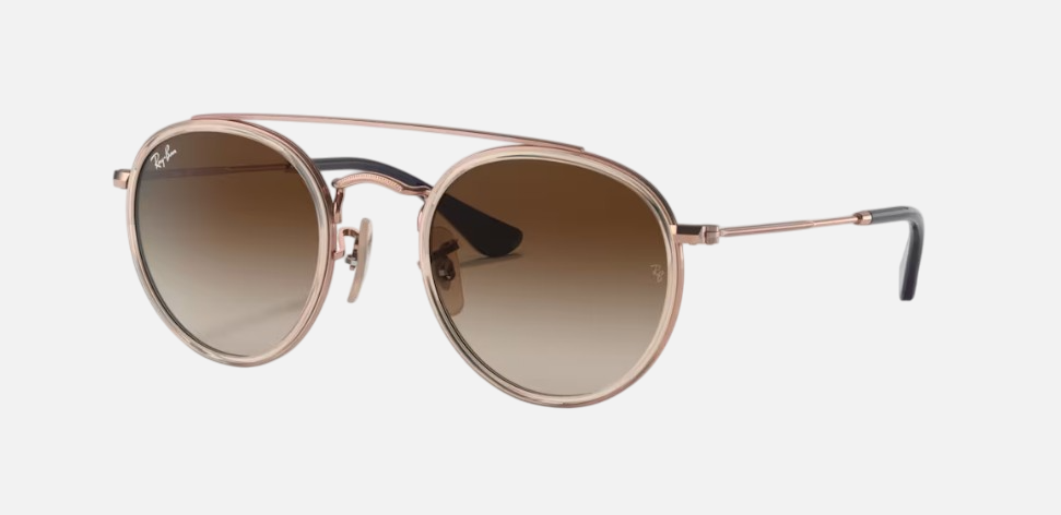 Ray-Ban Junior Round Double Bridge Kids RJ9647S 288/13 round sunglasses for kids in full rim metal, with polished light brown frame, and brown gradient lenses. 46mm in lens size, 21mm in bridge size, and 130mm in temple length.