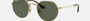 Ray-Ban Junior Jack Kids RJ9565S 223/71 irregular sunglasses for kids in full rim metal, with polished arista gold frame, and green lenses. 47mm in lens size, 19mm in bridge size, and 130mm in temple length.