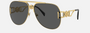 Versace VE2255 100287 pilot sunglasses for unisex in full rim metal, with gold frame, and dark grey lenses. 63mm in lens size, 13mm in bridge size, and 145mm in temple length.