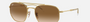Ray-Ban RB3707 001/51 hexagonal sunglasses for unisex in full rim metal, with gold frame, and brown lenses.